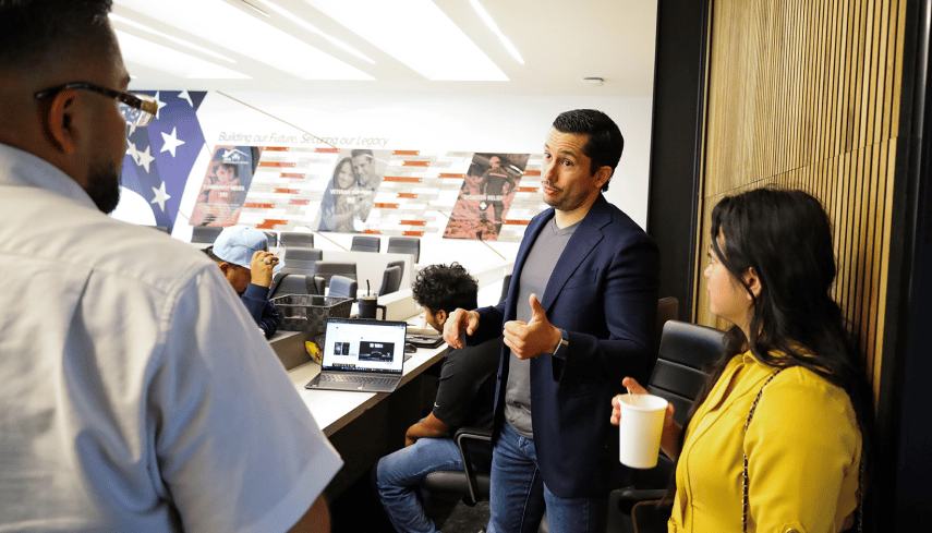 Pancho giving thumbs up in classroom. 